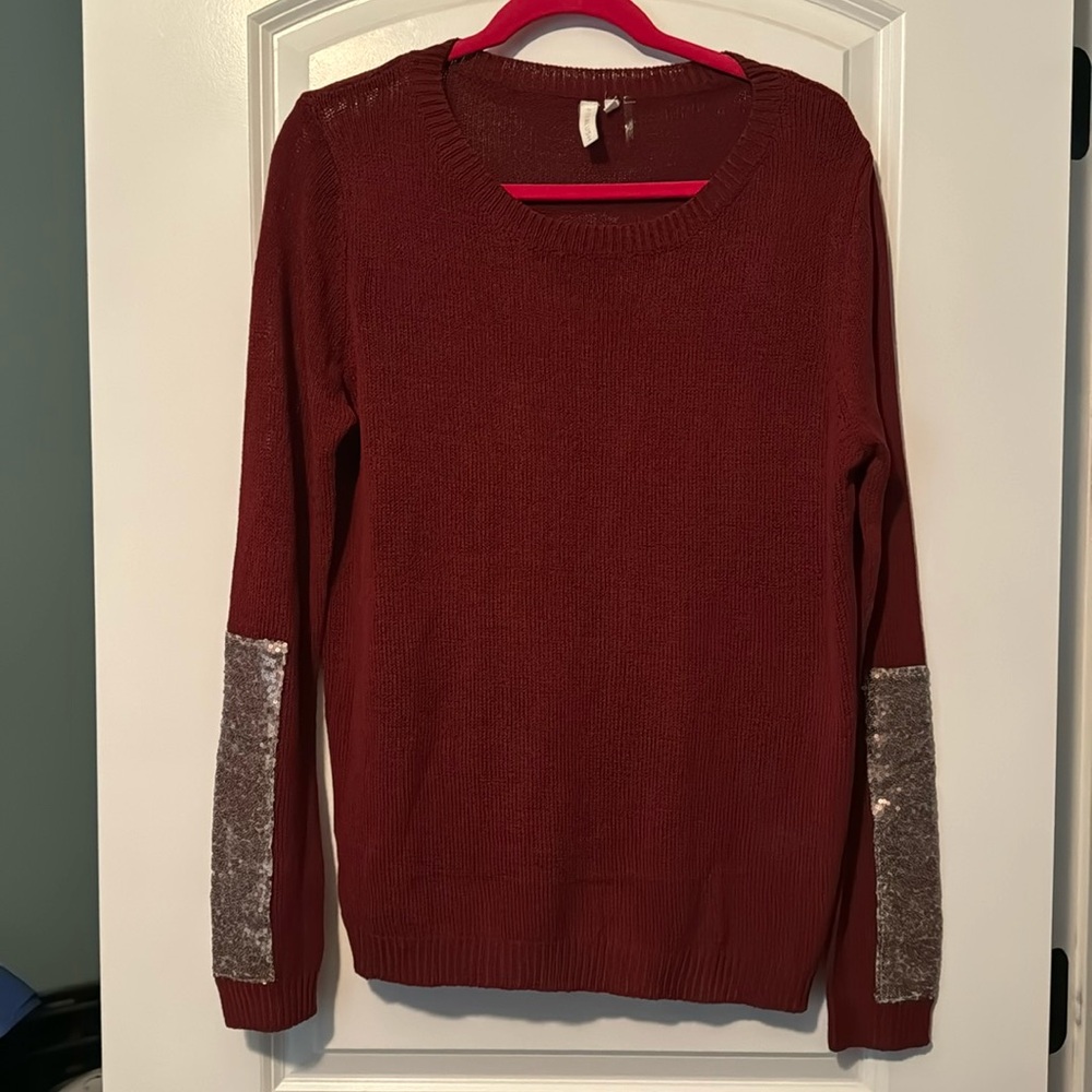 Burgundy Sweater with Rose gold sequin trim on bottom of sleeve.